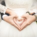 The Flying Fish Wedding Barn bride and groom heart hands 13
