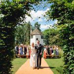 Homme House Couple walk aisle at end of Homme House outdoor wedding ceremony Che Birch Hayes Photography 25