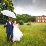 Homme House Wedding couple portrait with umbrella in Homme House parkland David Liebst Photography 35