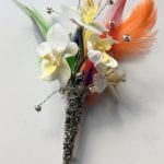 Grooms buttonhole in silver holder