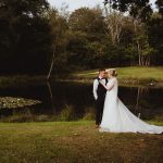 Cottesmore Hotel Golf and Country Club Bride and Groom at the lake 2.jpg 17