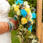 Muslim bride holding wedding bouquet