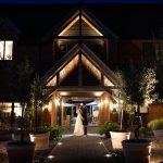 Cottesmore Hotel Golf and Country Club Bride and Groom Front entrance night.jpg 2