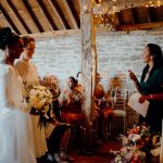 Grittenham Barn Stacey & Sara October Graham Nixon Inside barn ceremony .jpg 26