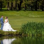 Cottesmore Hotel Golf and Country Club Bride and Groom at Lake.jpg 9