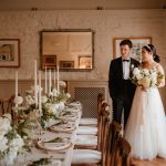 Bride and groom in historic dining room
