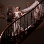 Homme House Bride descends spiral staircase at Homme House.jpg 16