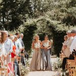 Homme House Bridesmaids enter outdoor wedding ceremony space at Homme House.jpg 24
