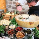 Gnocci bar with a cheese wheele for evening food by Epic Caterers. Live, interactive cooking with a chef.