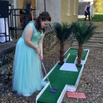 Guest playing the Palms hole, course setup by Putt Putt Golf crazy golf hire