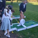 Guests playing Putt Putt Golf's mini golf course at wedding
