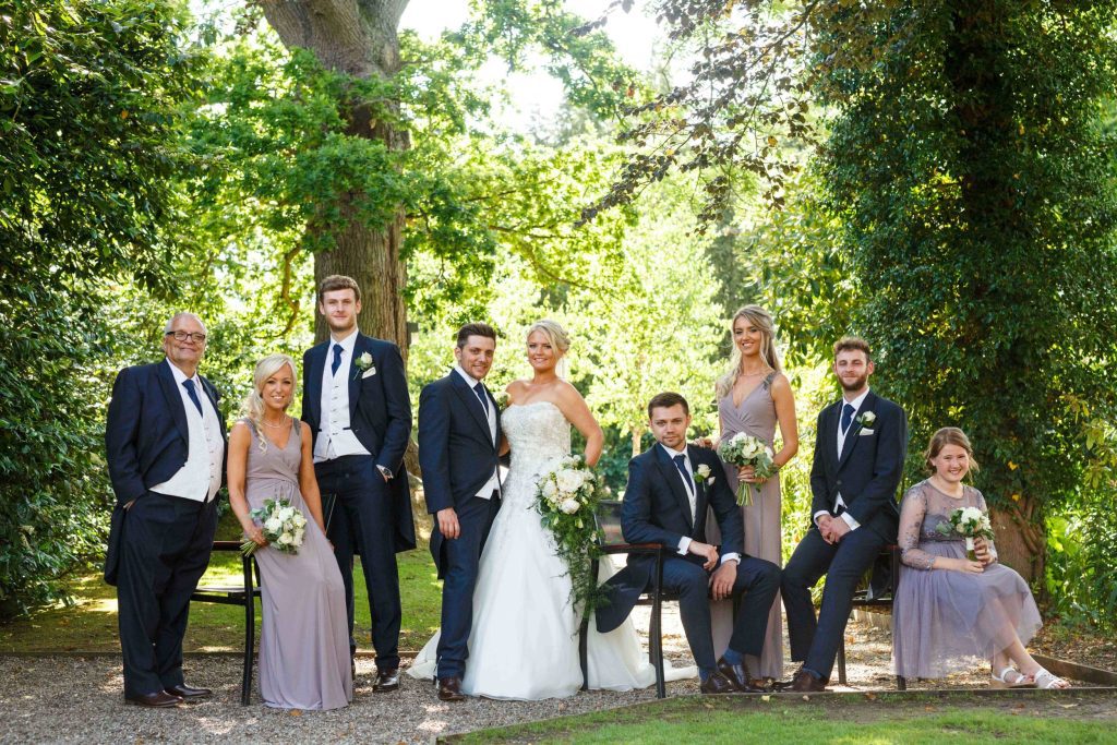 Top Wedding Venues Essex Bridal party in garden scaled 10
