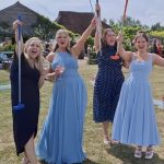 female guests playing mini golf