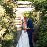 Wedding kiss in pergola walk, Marden Park, Surrey - Big Day Productions